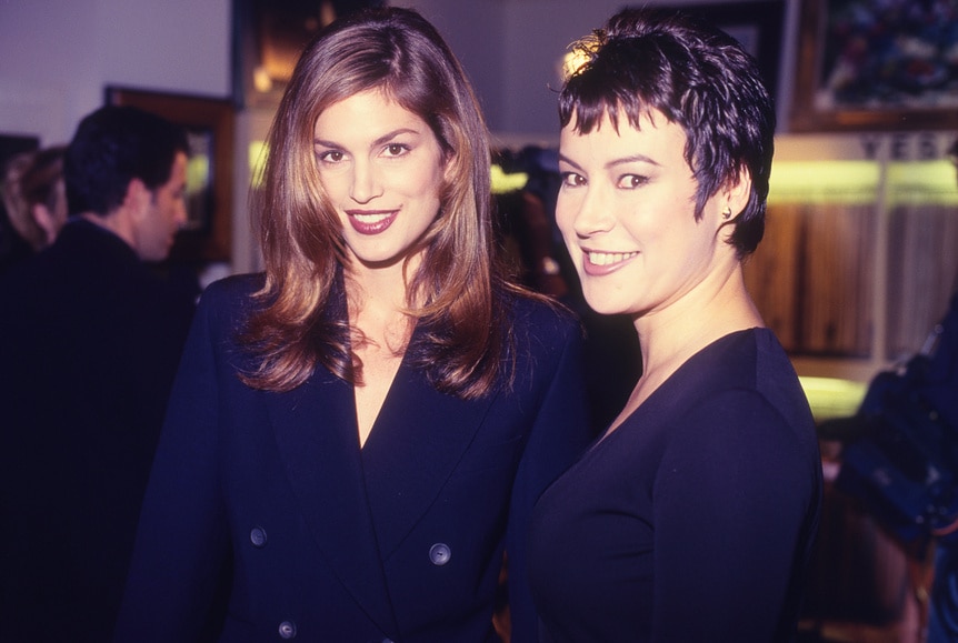 Cindy Crawford and Jennifer Tilly wearing black together.